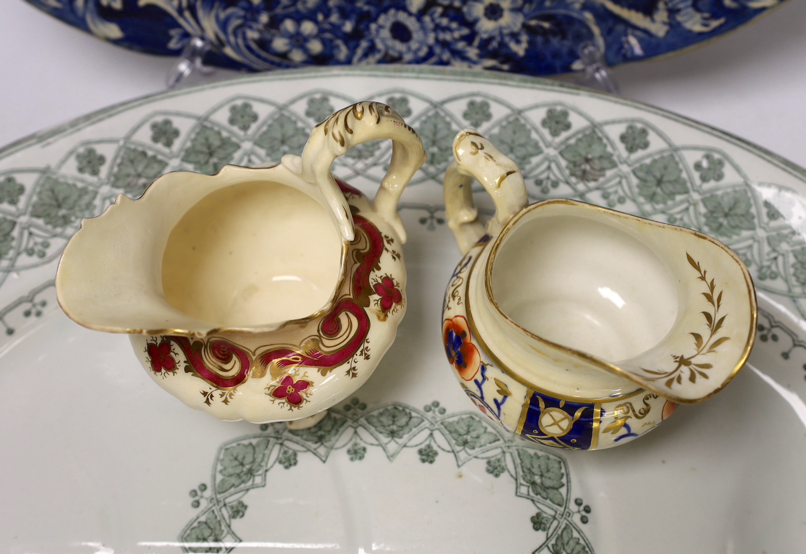 A Davenport meat dish, another and two jugs, largest 53cm